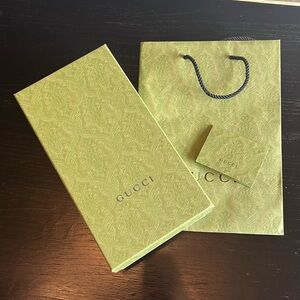 Gucci box, bag, and receipt holder.